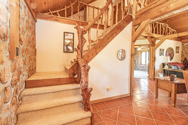 12926 Daisy Ln SW, Farwell, MN 56327 - staircase featuring wooden ceiling, tile patterned flooring, baseboards, and lofted ceiling
