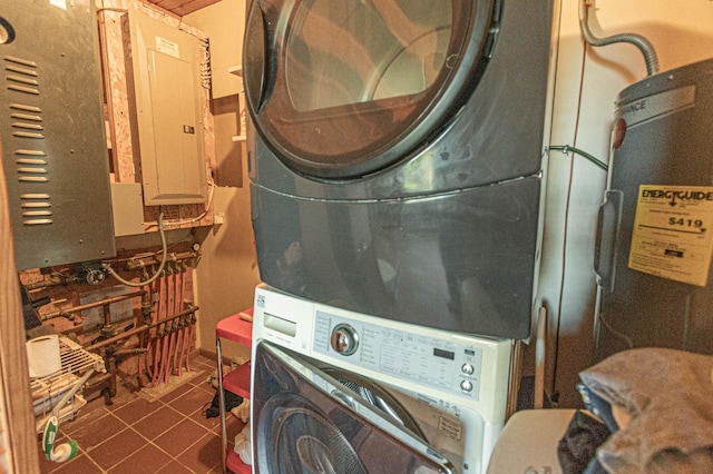 12926 Daisy Ln SW, Farwell, MN 56327 - laundry area with stacked washer and clothes dryer, electric panel, and dark tile patterned flooring