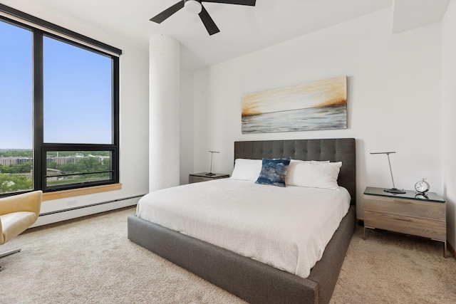 1240 2nd St Unit 822, Minneapolis, MN 55415 - bedroom featuring carpet flooring, multiple windows, baseboard heating, and ceiling fan