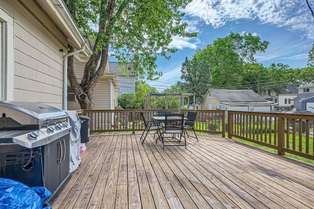 900 Charles Ave, Saint Paul, MN 55104 - wooden deck featuring outdoor dining area and grilling area