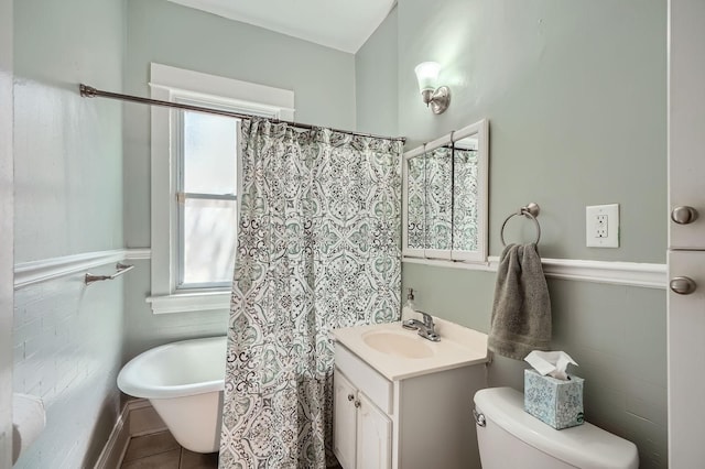 900 Charles Ave, Saint Paul, MN 55104 - full bath with vanity, a soaking tub, toilet, and tile patterned flooring