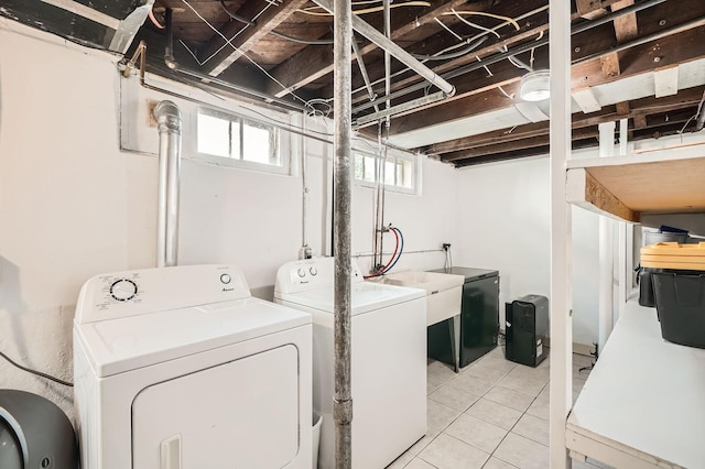 900 Charles Ave, Saint Paul, MN 55104 - washroom with independent washer and dryer and light tile patterned flooring