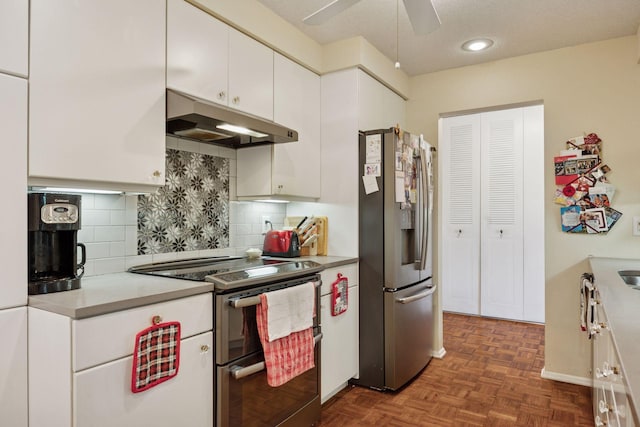 4360 Brookside Ct Unit 305, Edina, MN 55436 - kitchen featuring appliances with stainless steel finishes, under cabinet range hood, ceiling fan, white cabinetry, and decorative backsplash