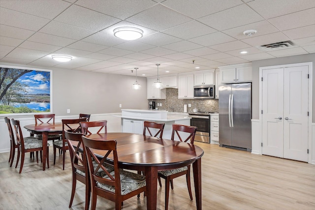 4360 Brookside Ct Unit 305, Edina, MN 55436 - dining space featuring light wood-style floors and a drop ceiling