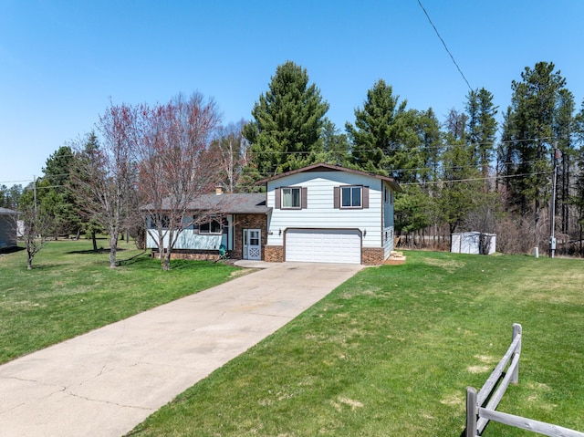 22 Cottonwood Ct, Babbitt, MN 55706 - split level home with an attached garage, concrete driveway, and brick siding