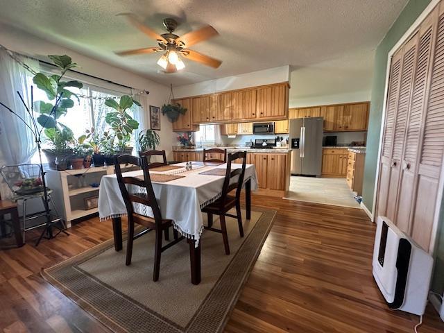 22 Cottonwood Ct, Babbitt, MN 55706 - dining room featuring ceiling fan, a textured ceiling, and wood finished floors
