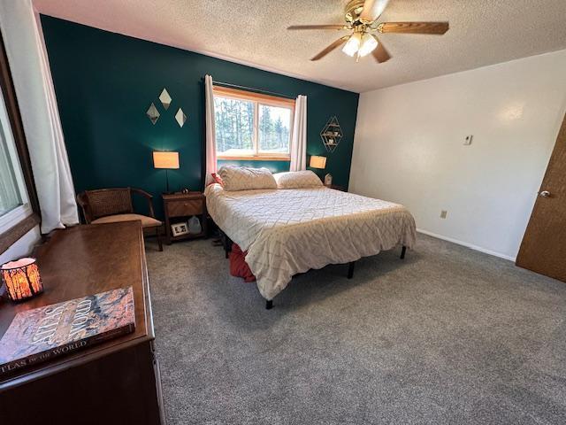 22 Cottonwood Ct, Babbitt, MN 55706 - bedroom with a textured ceiling, carpet flooring, and ceiling fan