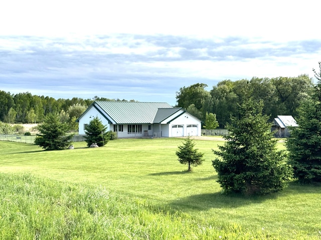 2563 125th Ave, Braham, MN 55006 - view of front of home featuring an attached garage and metal roof