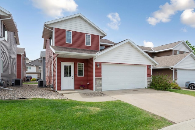 105 Owl Path, Mankato, MN 56001 - traditional home featuring central air condition unit, a garage, concrete driveway, a front lawn, and stone siding