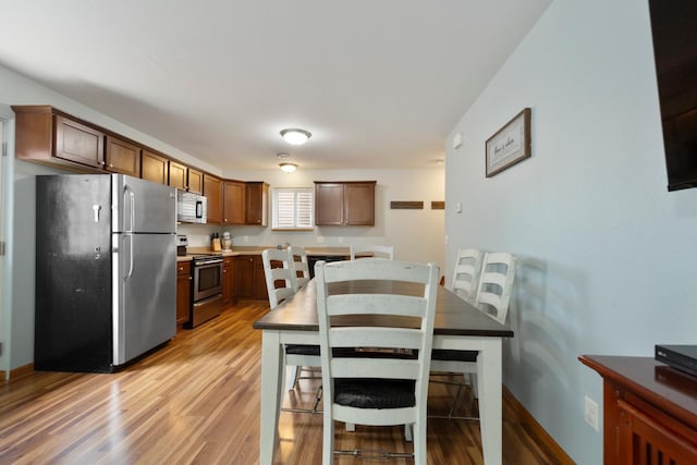 105 Owl Path, Mankato, MN 56001 - kitchen with appliances with stainless steel finishes, light wood-style flooring, and baseboards