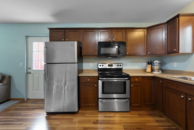 105 Owl Path, Mankato, MN 56001 - kitchen with appliances with stainless steel finishes, light wood-type flooring, and light countertops