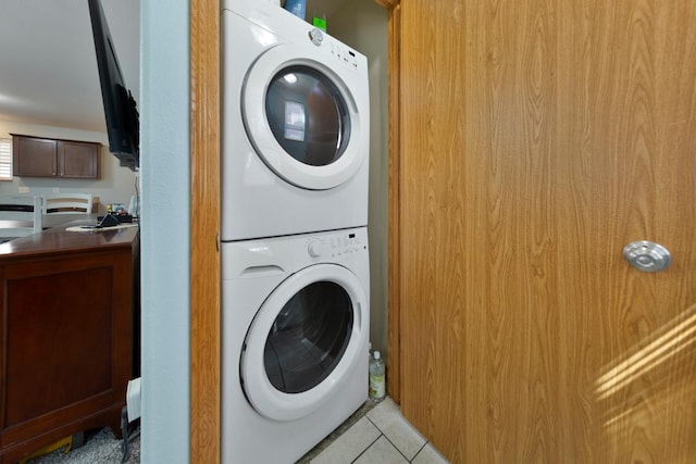 105 Owl Path, Mankato, MN 56001 - laundry room with stacked washing machine and dryer and light tile patterned floors