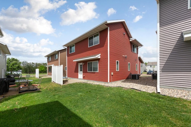 105 Owl Path, Mankato, MN 56001 - rear view of property with a patio, a lawn, and central AC