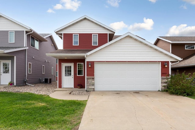 105 Owl Path, Mankato, MN 56001 - traditional-style home featuring central AC unit, stone siding, an attached garage, concrete driveway, and a front yard