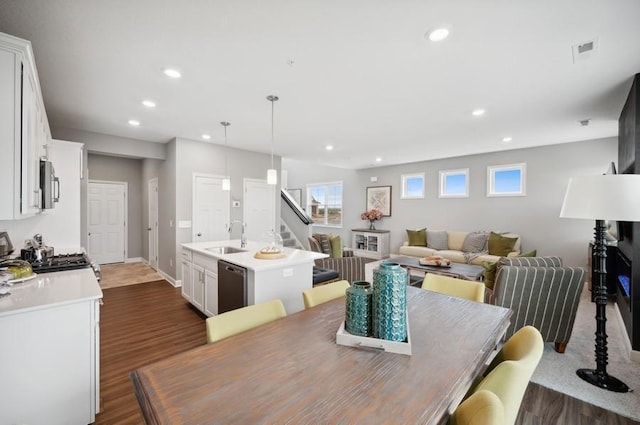 2154 Tyrone Dr, Shakopee, MN 55379 - dining space featuring dark wood-style floors, recessed lighting, stairway, and baseboards