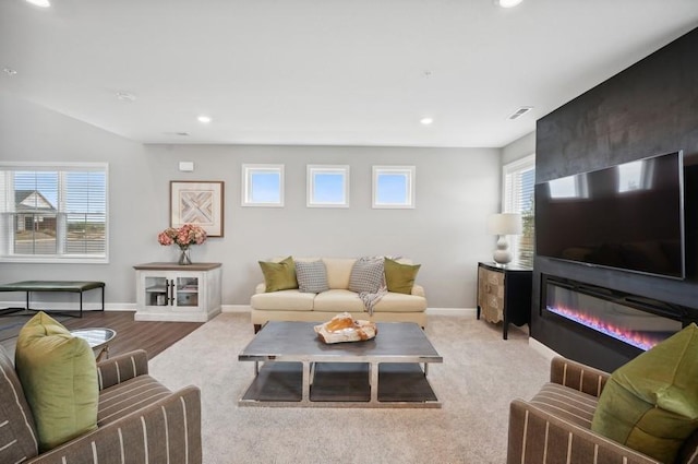 2154 Tyrone Dr, Shakopee, MN 55379 - carpeted living room featuring a fireplace, recessed lighting, and baseboards