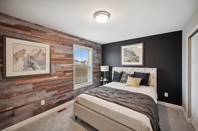 2154 Tyrone Dr, Shakopee, MN 55379 - carpeted bedroom with wooden walls, an accent wall, and baseboards