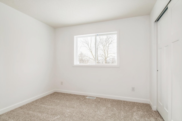 2354 Jandell Ave NE, Saint Michael, MN 55376 - unfurnished bedroom with carpet flooring, baseboards, and a closet