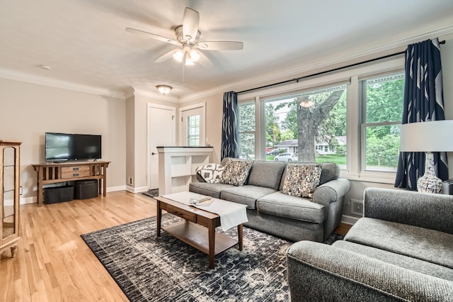 4989 Turtle Ln W, Shoreview, MN 55126 - living room featuring ceiling fan, ornamental molding, light wood-style floors, and baseboards
