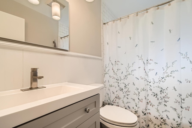 4989 Turtle Ln W, Shoreview, MN 55126 - bathroom with toilet, vanity, and curtained shower