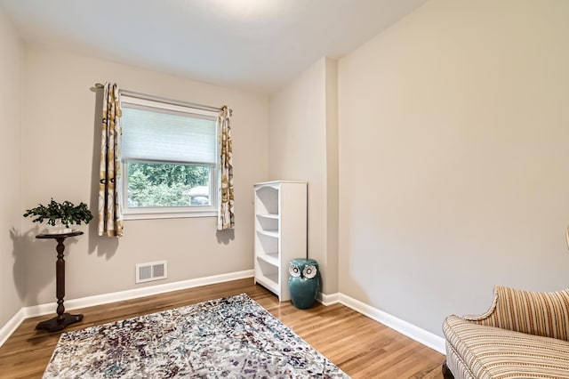 4989 Turtle Ln W, Shoreview, MN 55126 - sitting room with wood finished floors and baseboards