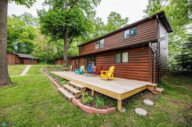 41780 Kansas Point Ln, Pelican Rapids, MN 56572 - back of house with a lawn, a wooden deck, and log veneer siding