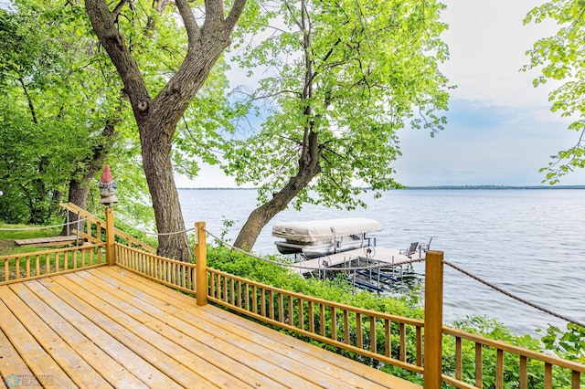 41780 Kansas Point Ln, Pelican Rapids, MN 56572 - wooden deck with a water view and a boat dock