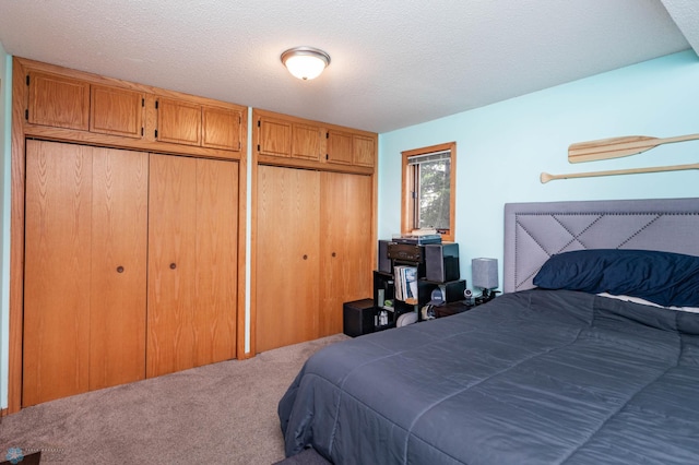 41780 Kansas Point Ln, Pelican Rapids, MN 56572 - carpeted bedroom with a textured ceiling and multiple closets