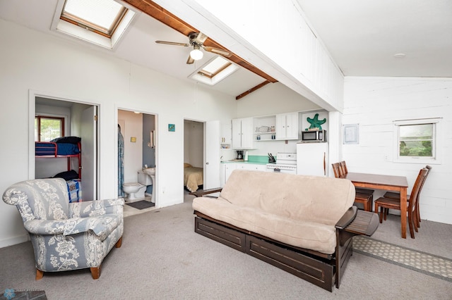 41780 Kansas Point Ln, Pelican Rapids, MN 56572 - living area with attic access, light colored carpet, vaulted ceiling, and a ceiling fan