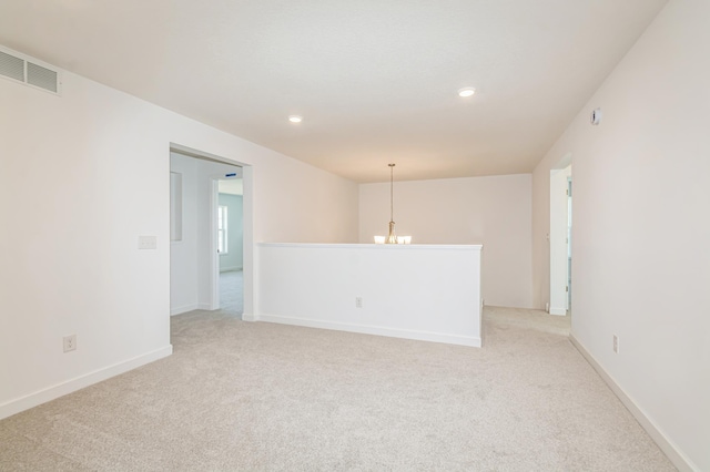 6743 Tamarack Ln, Corcoran, MN 55340 - empty room featuring light colored carpet, recessed lighting, a chandelier, and baseboards