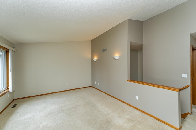 2225 Fisher Ct NW, Rochester, MN 55901 - unfurnished room with light colored carpet and a textured ceiling