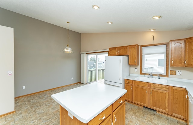2225 Fisher Ct NW, Rochester, MN 55901 - kitchen with freestanding refrigerator, lofted ceiling, light countertops, decorative light fixtures, and a center island