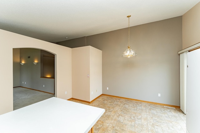 2225 Fisher Ct NW, Rochester, MN 55901 - unfurnished room with arched walkways and vaulted ceiling