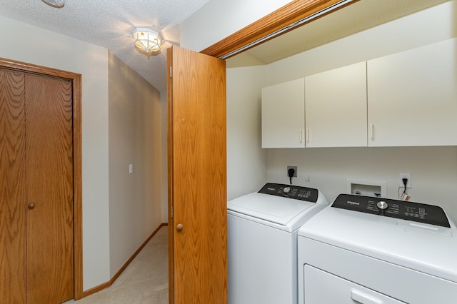 2225 Fisher Ct NW, Rochester, MN 55901 - laundry area featuring cabinet space, light colored carpet, and washing machine and clothes dryer