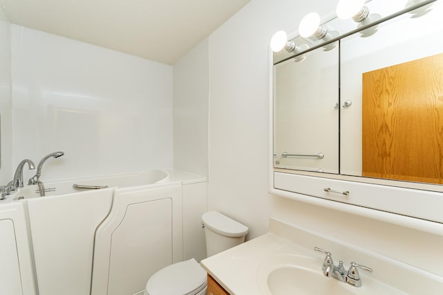 2225 Fisher Ct NW, Rochester, MN 55901 - full bathroom featuring vanity and a tub to relax in