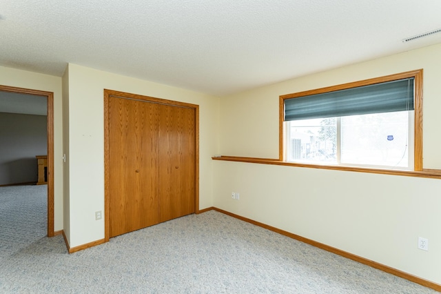 2225 Fisher Ct NW, Rochester, MN 55901 - unfurnished bedroom with a closet and carpet flooring