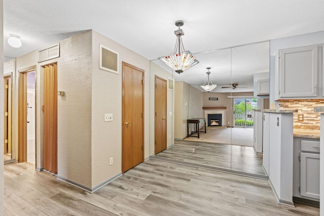 2310 Benson Ave Unit H, Saint Paul, MN 55116 - corridor featuring light wood-style flooring