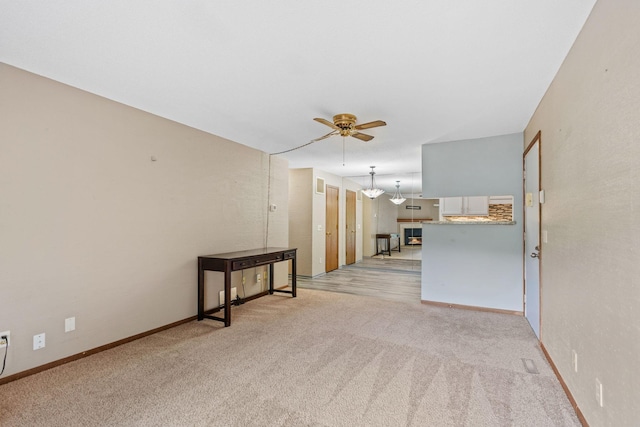 2310 Benson Ave Unit H, Saint Paul, MN 55116 - unfurnished room featuring a ceiling fan, light carpet, and baseboards