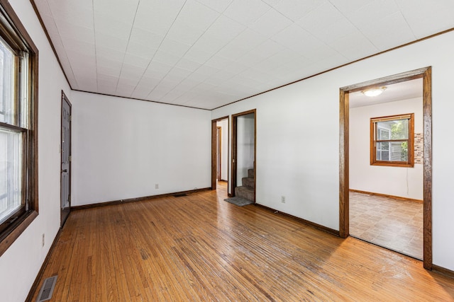 917 Jessie St, Saint Paul, MN 55130 - spare room with stairway and hardwood / wood-style floors