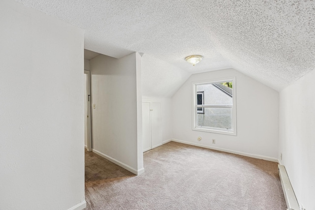 917 Jessie St, Saint Paul, MN 55130 - bonus room featuring a baseboard heating unit, a textured ceiling, vaulted ceiling, and carpet floors