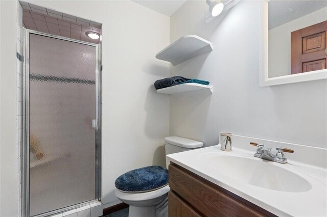 20907 Erickson Ln, Trade Lake, WI 54840 - full bathroom featuring a stall shower, toilet, and vanity