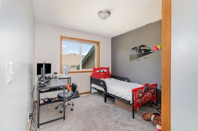509 8th Ave SE, Isanti, MN 55040 - bedroom with carpet, a desk, baseboards, and a textured ceiling