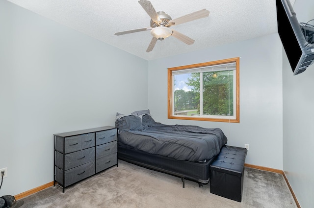 509 8th Ave SE, Isanti, MN 55040 - carpeted bedroom featuring baseboards, a textured ceiling, and a ceiling fan