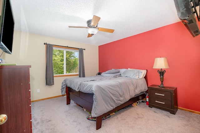 509 8th Ave SE, Isanti, MN 55040 - bedroom with carpet floors, baseboards, a ceiling fan, and a textured ceiling