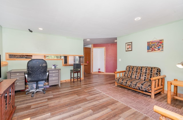 509 8th Ave SE, Isanti, MN 55040 - home office with wood finished floors, recessed lighting, and baseboards