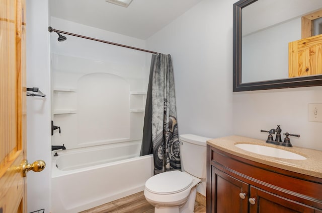 509 8th Ave SE, Isanti, MN 55040 - full bath featuring shower / bath combination with curtain, vanity, toilet, and wood finished floors