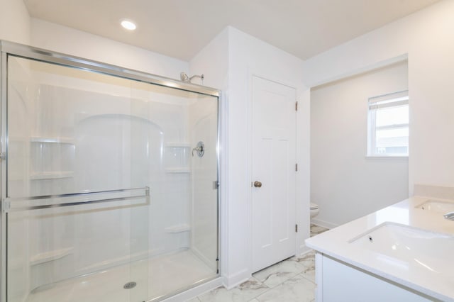 full bathroom featuring marble finish flooring, a shower stall, double vanity, toilet, and recessed lighting