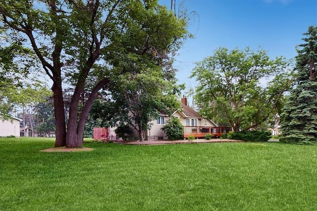 13993 Crosstown Blvd NW, Andover, MN 55304 - view of grassy yard featuring a wooden deck