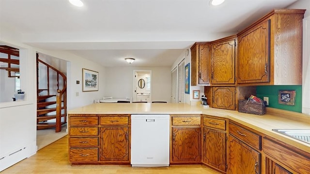13993 Crosstown Blvd NW, Andover, MN 55304 - kitchen featuring dishwasher, brown cabinets, a peninsula, light countertops, and recessed lighting