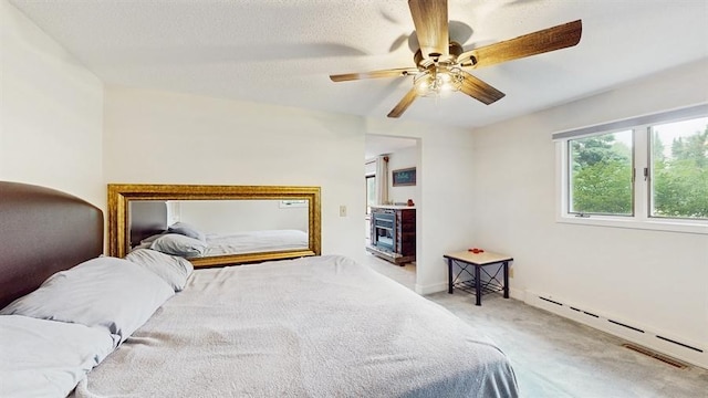 13993 Crosstown Blvd NW, Andover, MN 55304 - carpeted bedroom with a baseboard radiator and a ceiling fan